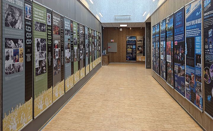 The Book and Blueshouse built by the festival showing a hallway with all the posters from previous years.
