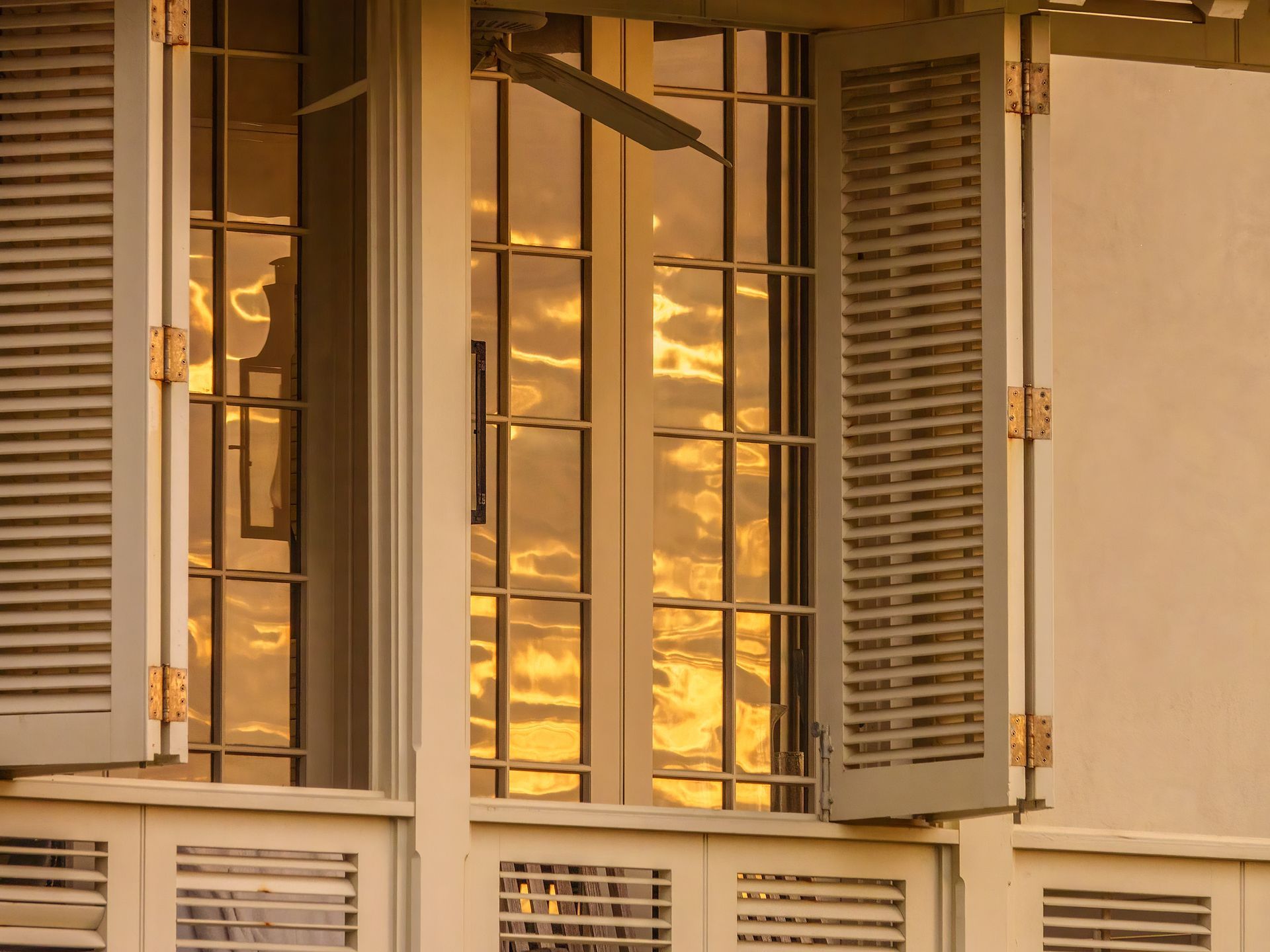 A sunset is reflected in the windows.