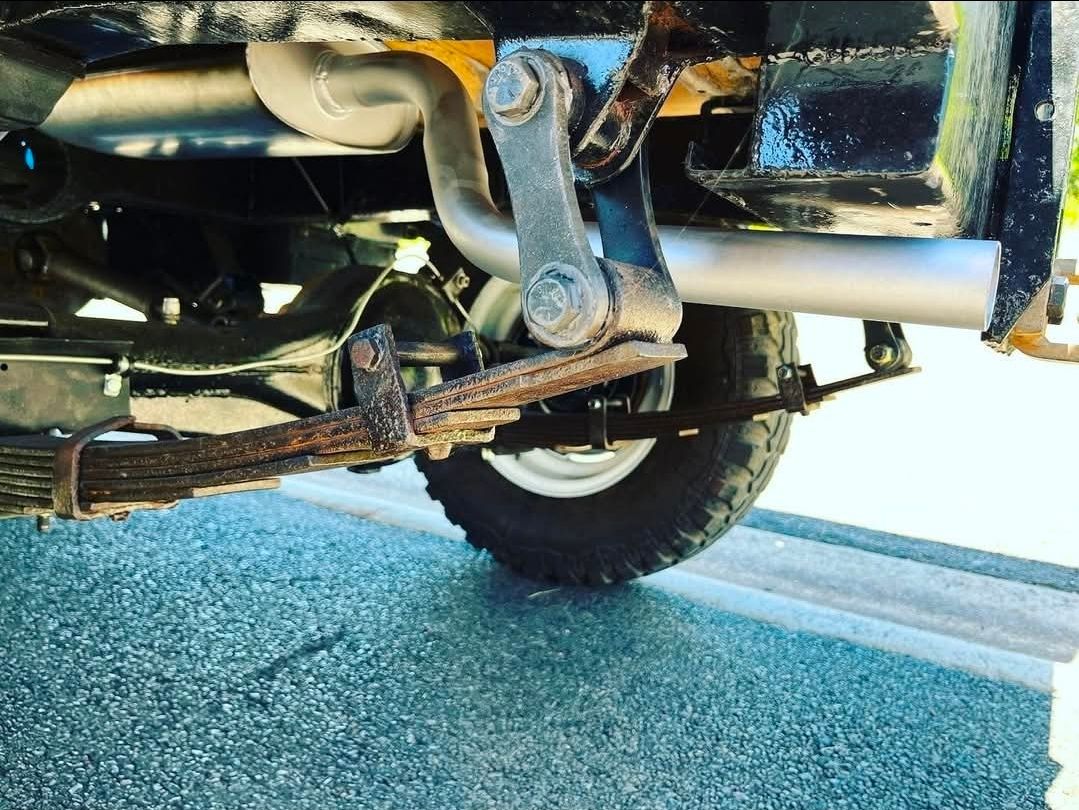 Shiny Chrome Exhaust Pipes on a Car — Atherton Mechanical Services in Atherton, QLD