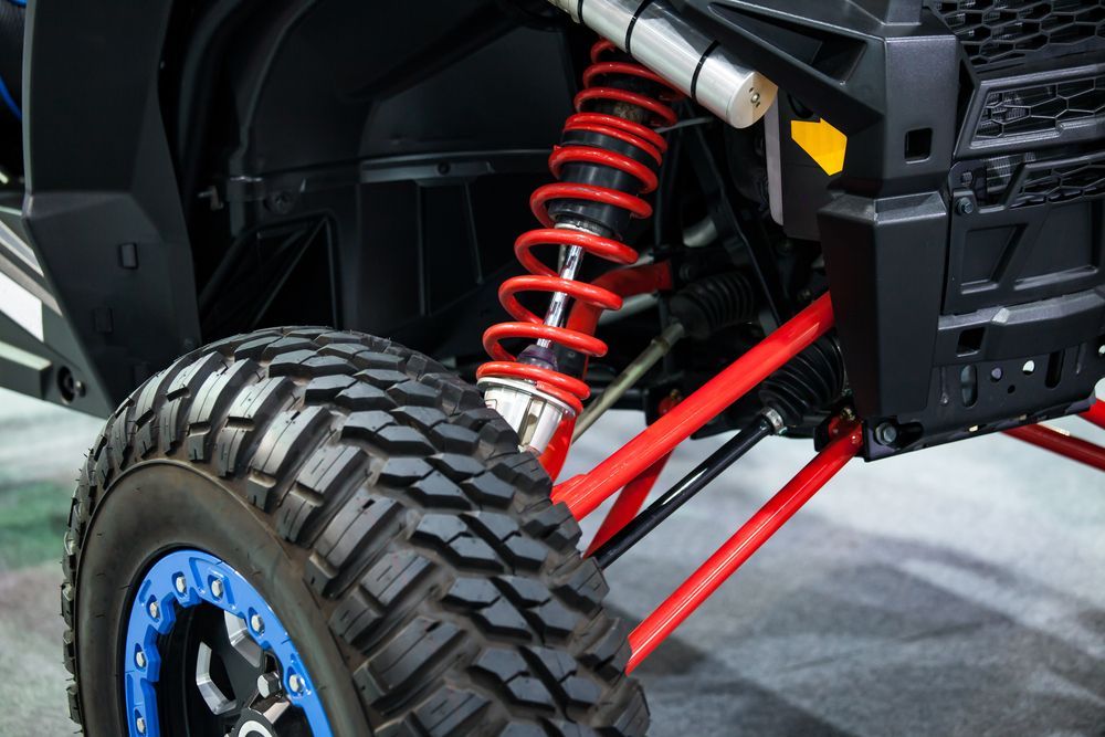 Close-up of an Off-road Vehicle's Front Wheel and Suspension — Atherton Mechanical Services in Atherton, QLD