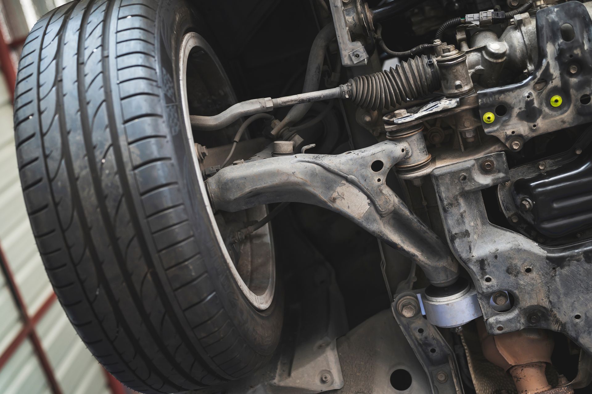 Close-up Of A Car's Front Tire And Suspension System — Atherton Mechanical Services in Atherton, QLD