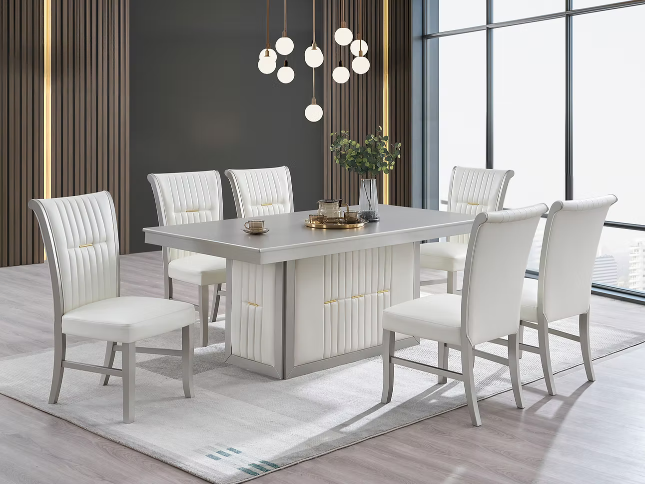 Dining room set with a rectangular gray table and six white chairs.