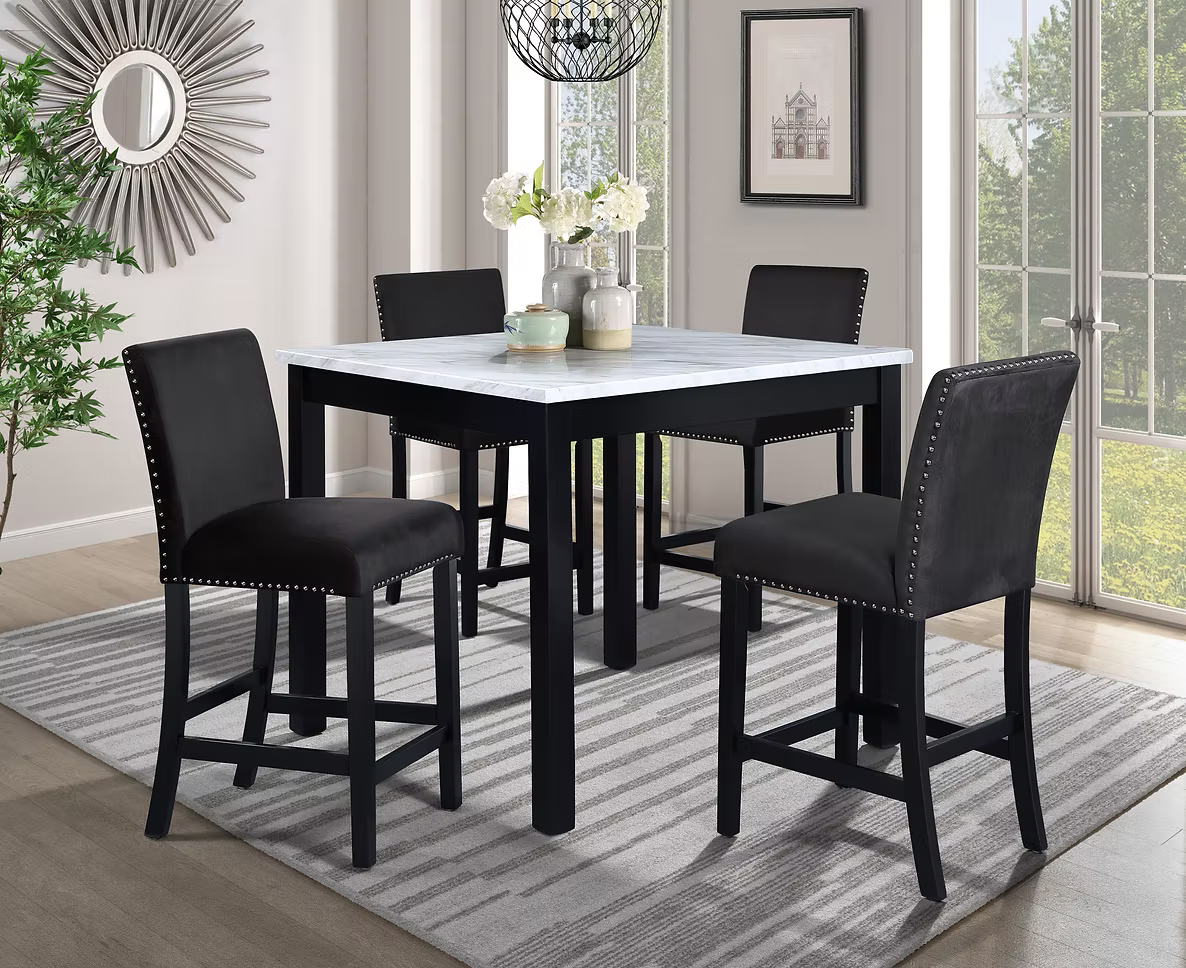 Black and white dining set: square table with four black bar stools on a patterned rug.
