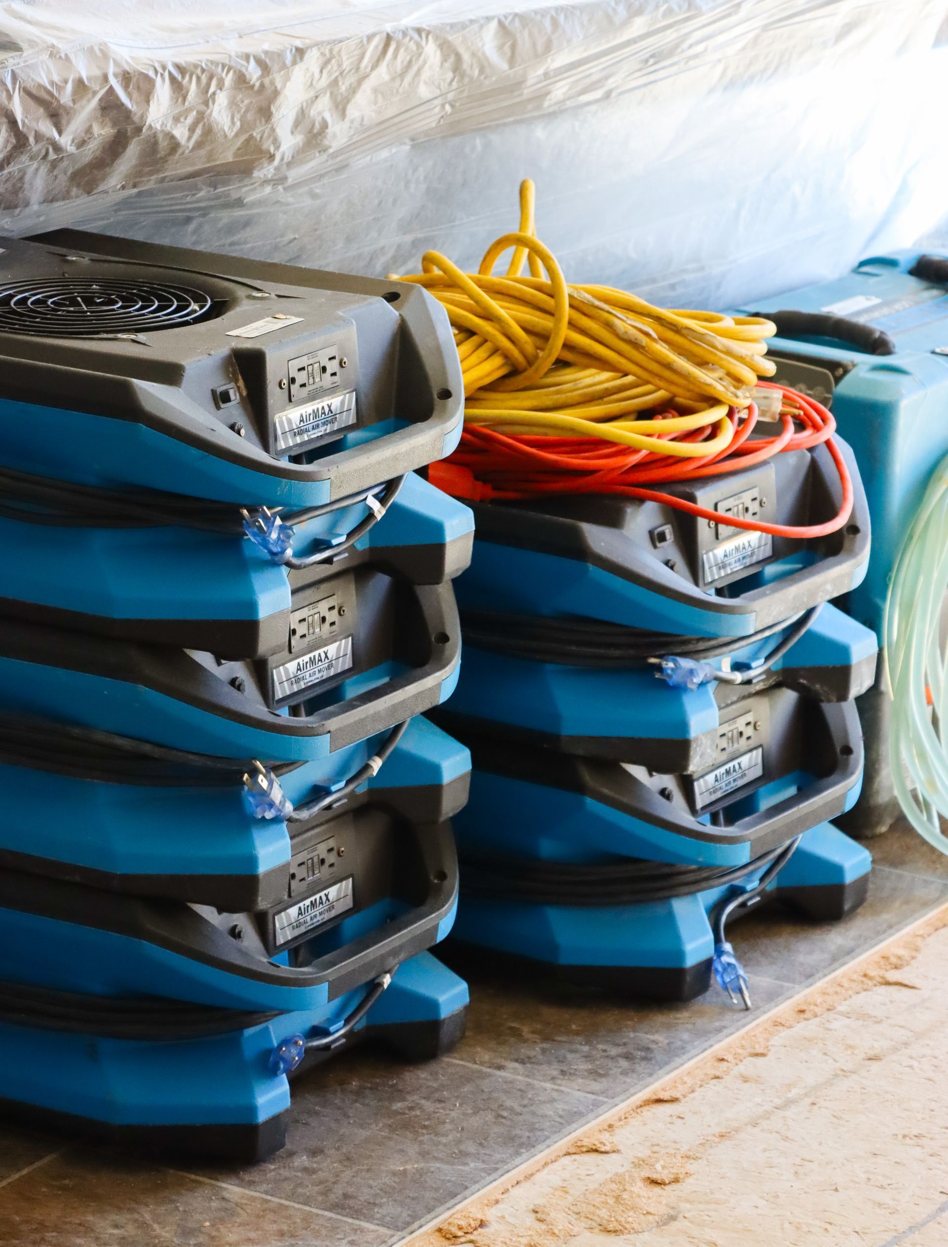A bunch of blue appliances are stacked on top of each other.