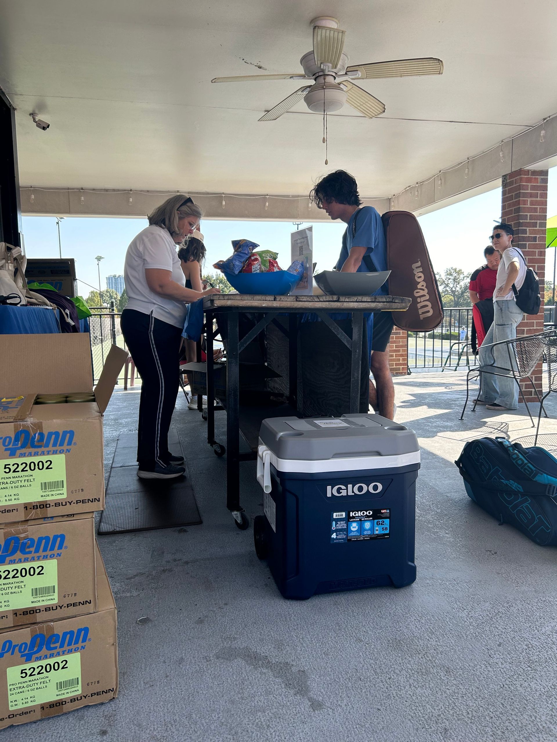 Tennis players reporting their scores at the USTA Missouri Valley event