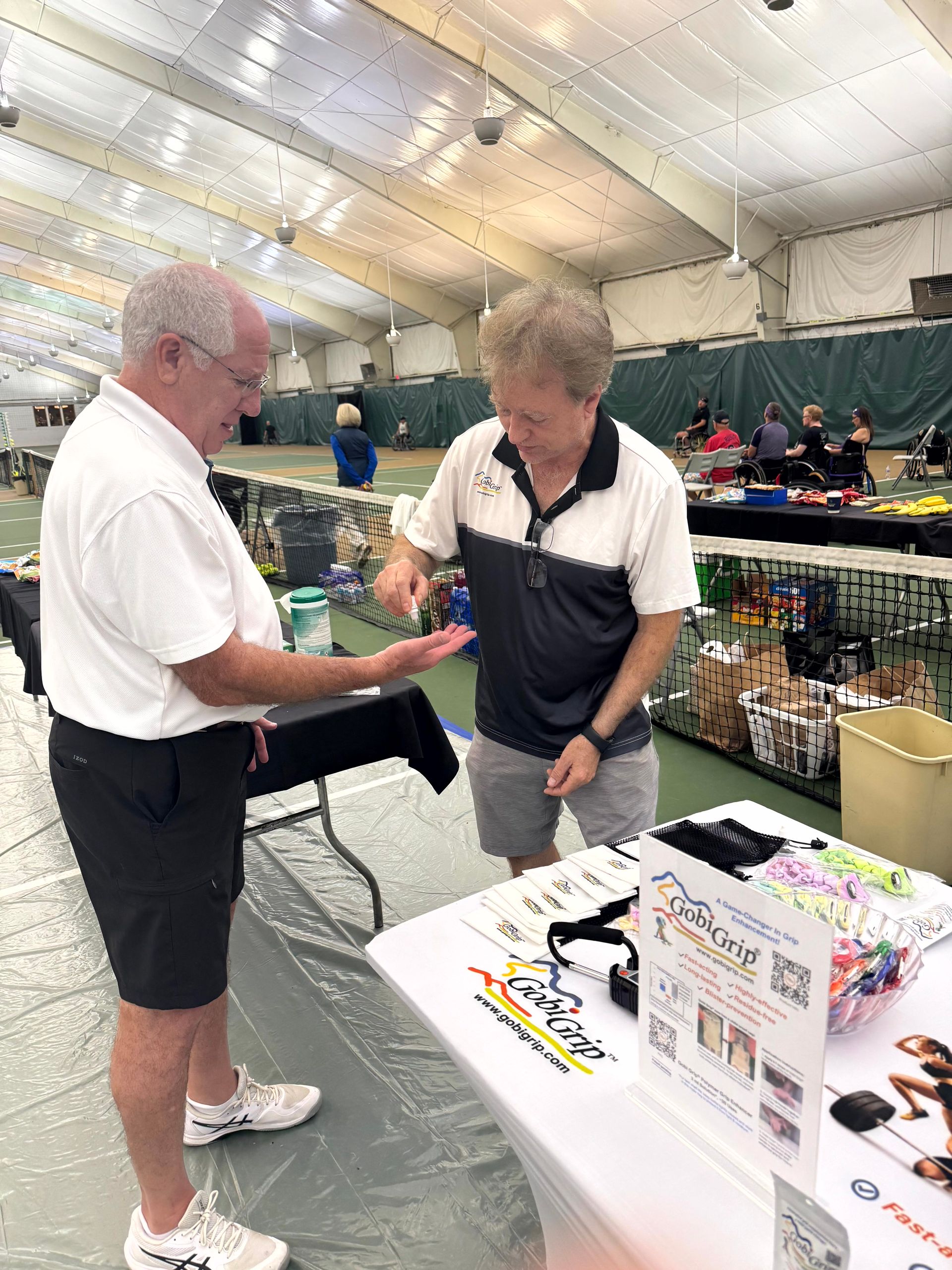 Tournament participant trying Gobi Grip at the USTA Level 2 St. Louis Indoor Wheelchair Tennis Championships