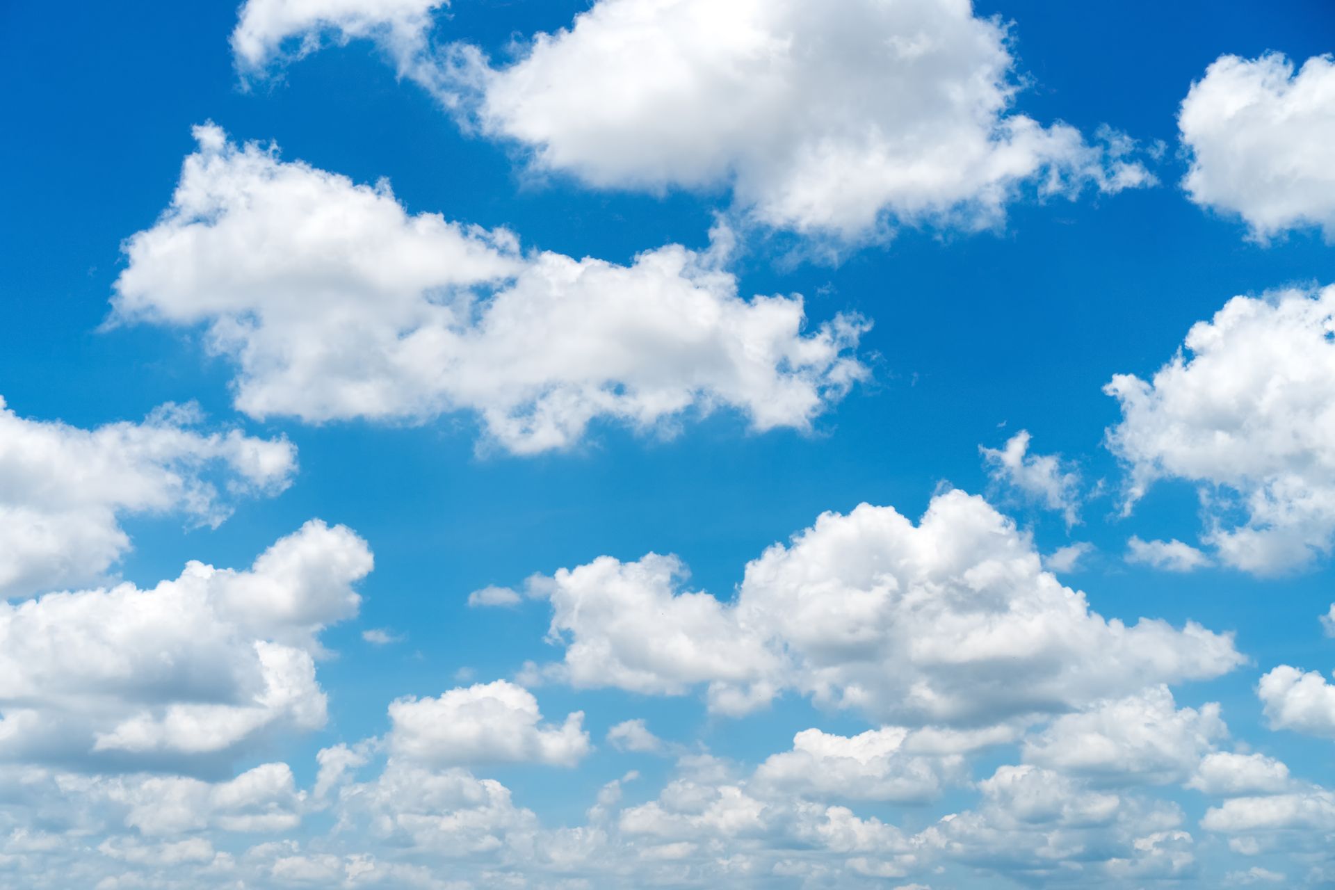 Blue sky with scattered white cumulus clouds. Blue sky with scattered white cumulus clouds.