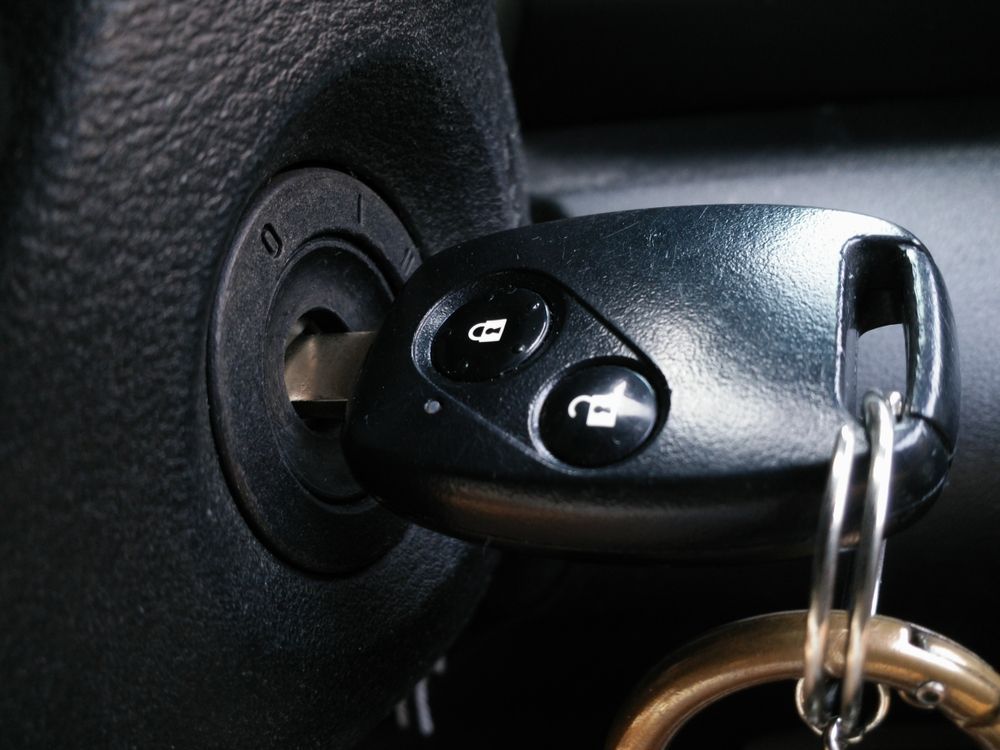 Car Key in Ignition With Key Fob and Keyring — Battery Assist Brisbane in Maroochydore, QLD