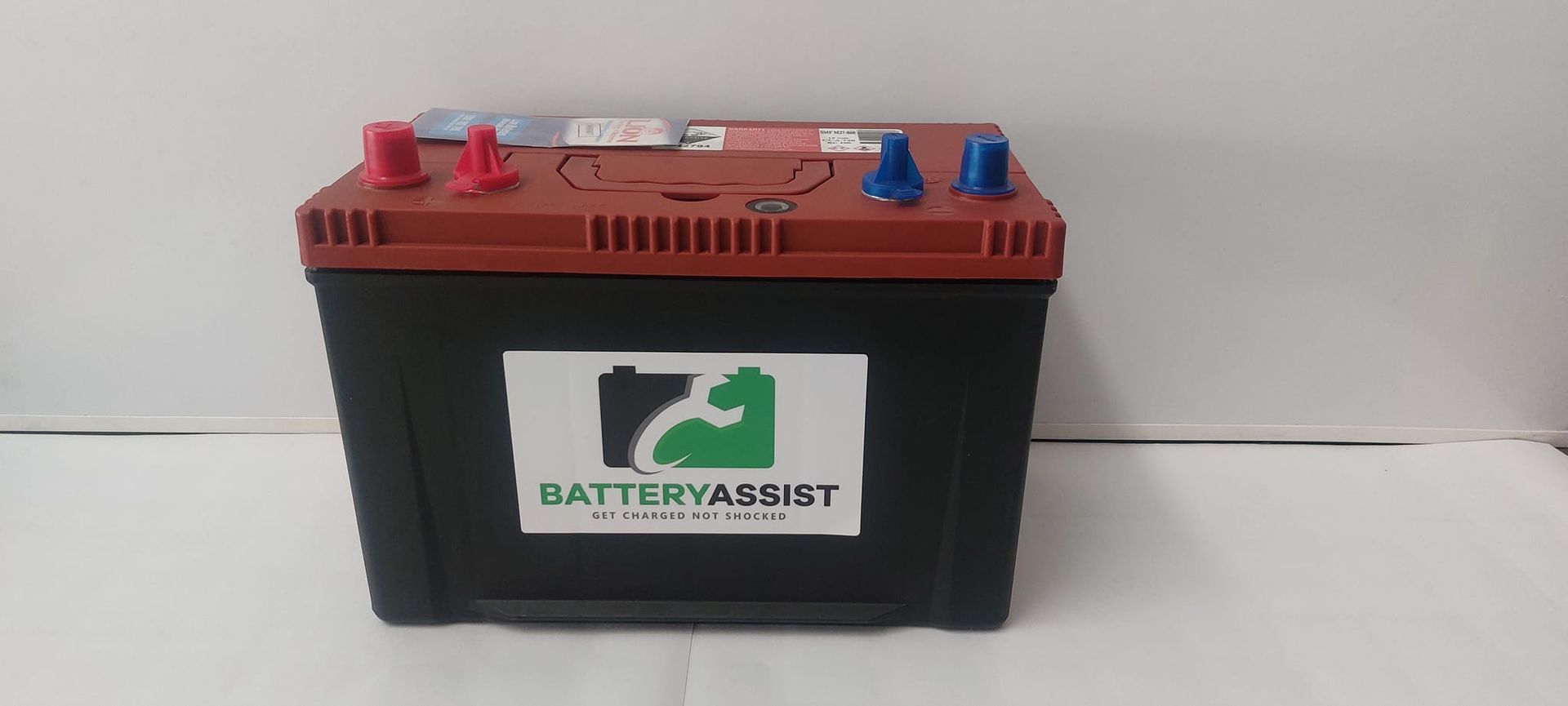 Black Battery With Red and Blue Terminals — Battery Assist Brisbane in Maroochydore, QLD