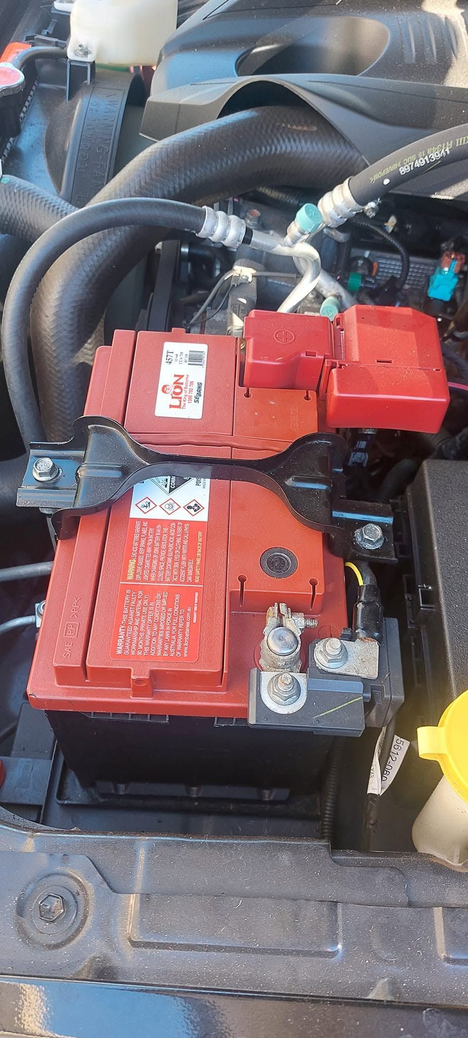 Close-up of Red Battery and Electrical Components — Battery Assist Brisbane in Bribie Island, QLD