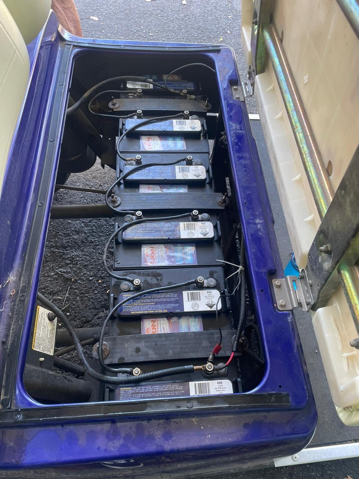 Open Battery Compartment With Six Connected Batteries — Battery Assist Brisbane in Sandgate, QLD