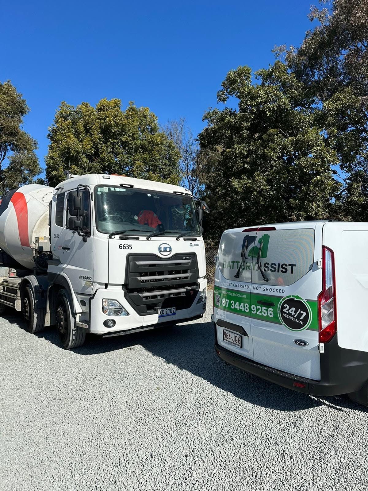 White Cement Truck Beside a Branded White Van — Battery Assist Brisbane in Albany Creek, QLD