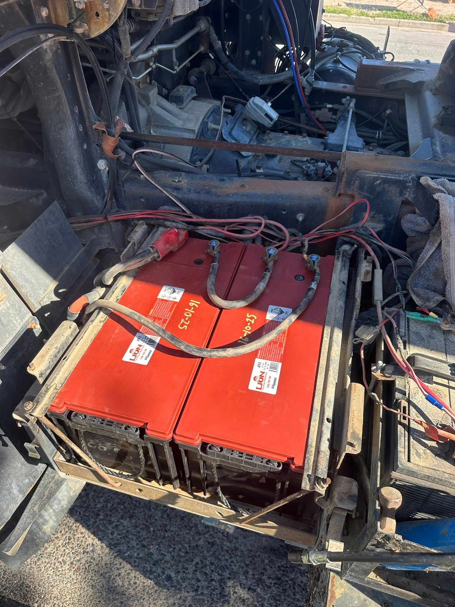 Two Red Batteries With Connected Wires — Battery Assist Brisbane in Albany Creek, QLD