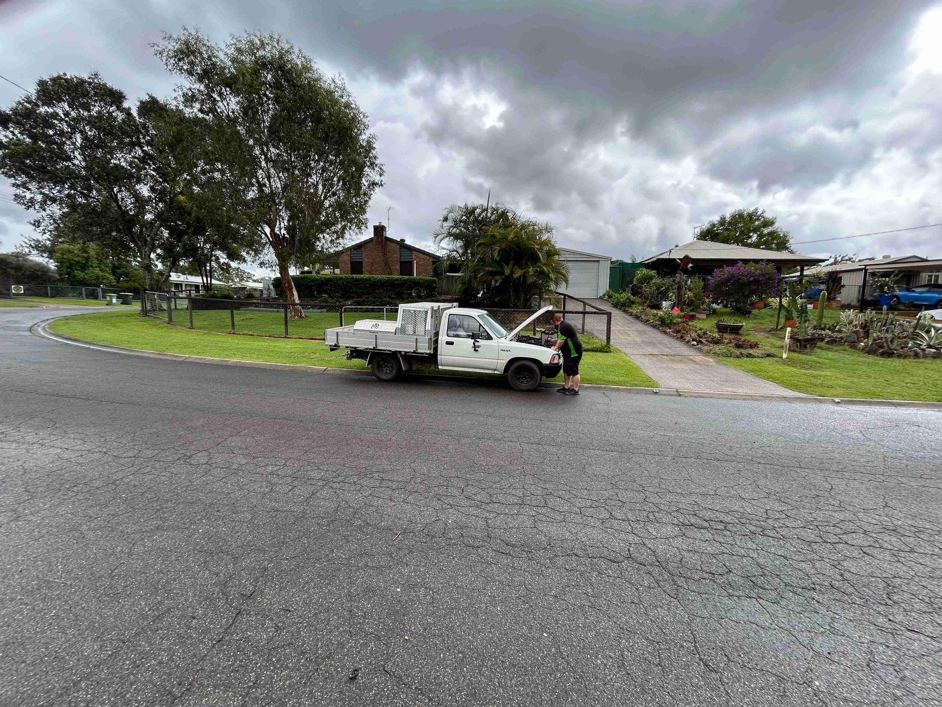 White Pickup Truck With Hood Open on a Residential Street — Battery Assist Brisbane in Caboolture, QLD