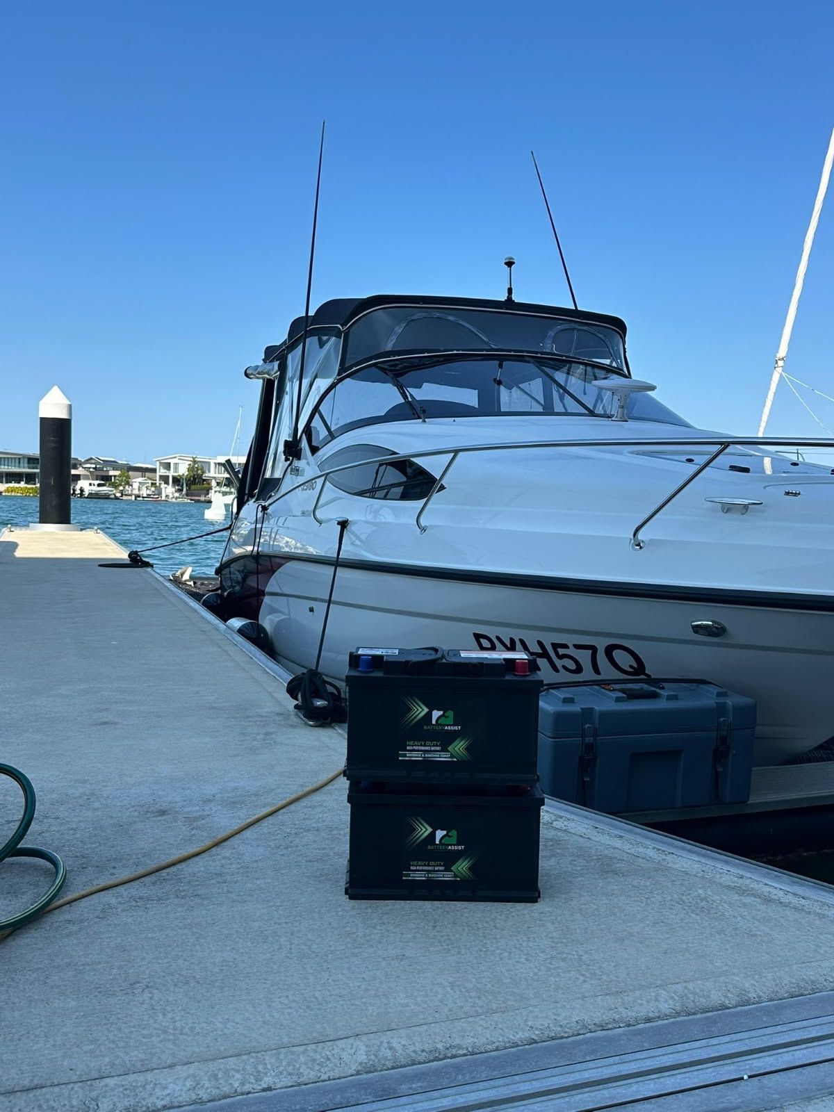 Two Black Containers Stacked on a Concrete Dock — Battery Assist Brisbane in Caboolture, QLD