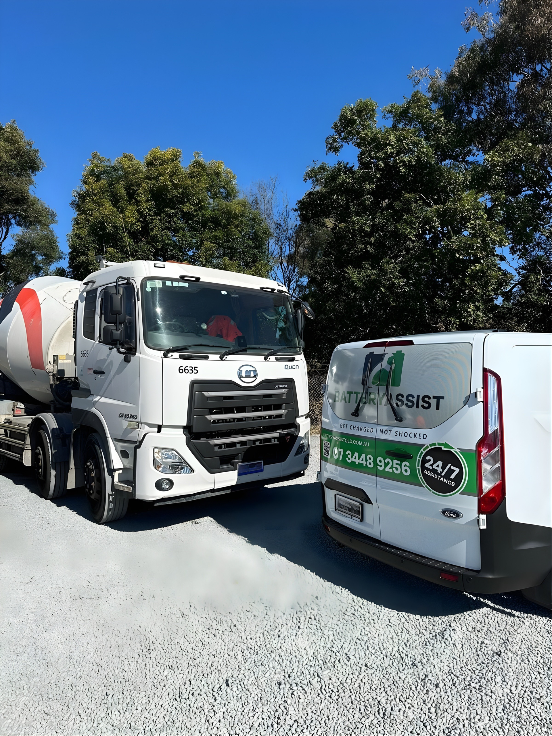 White Cement Truck and White Van Parked on Gravel — Battery Assist Brisbane in Deception Bay, QLD