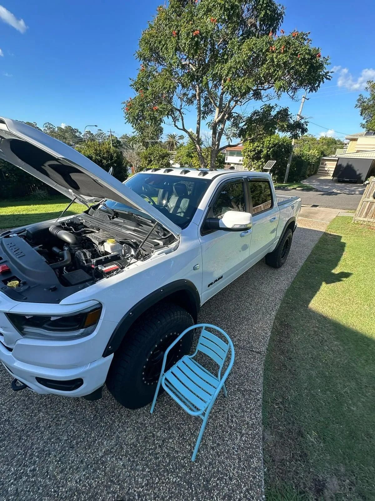 White Pickup Truck With Hood Open in a Driveway — Battery Assist Brisbane in Aspley, QLD