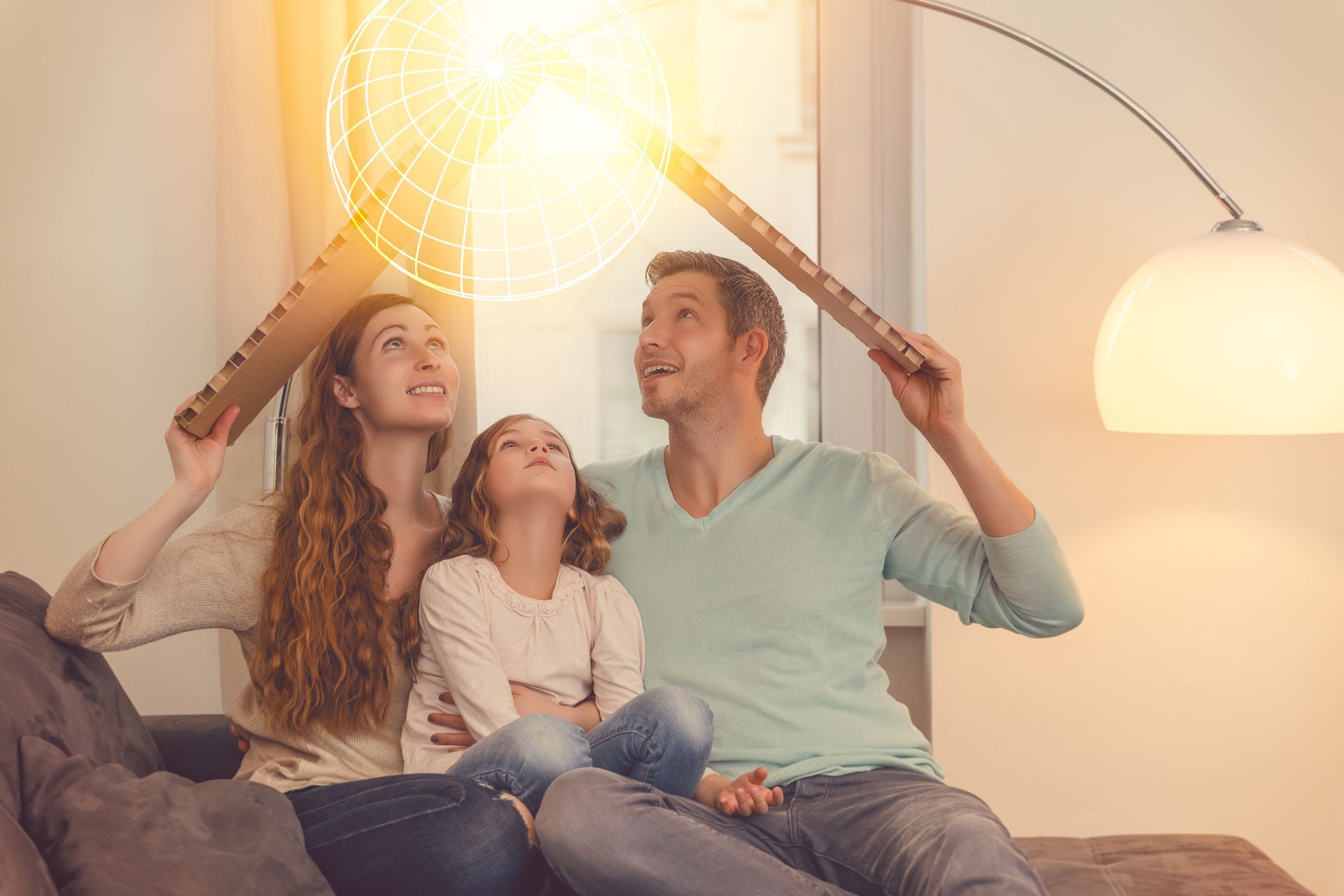 a family holding cardboard over their heads as a roof with a united insurance logo overlay