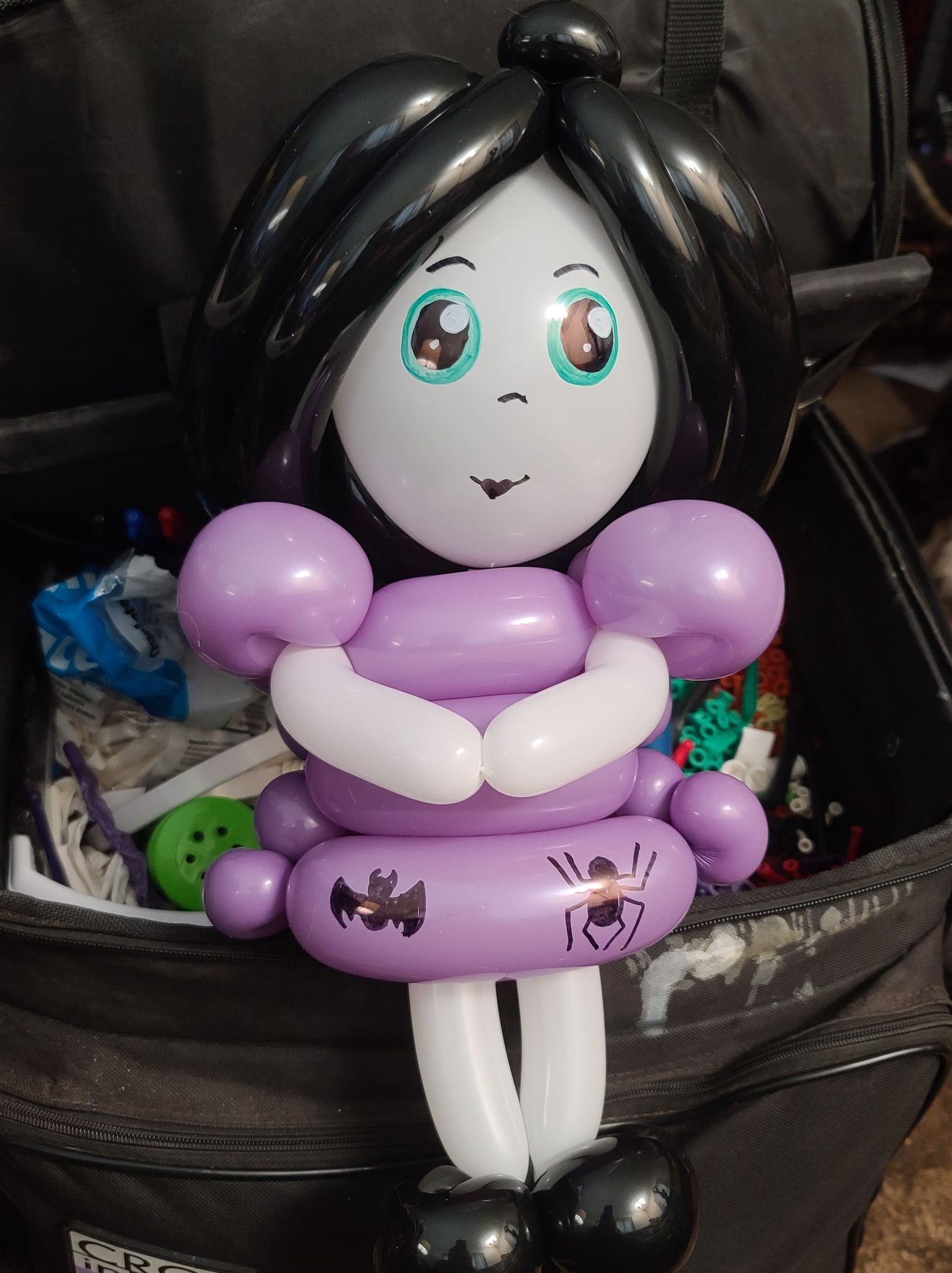 Balloon turkey sculpture held by a person.