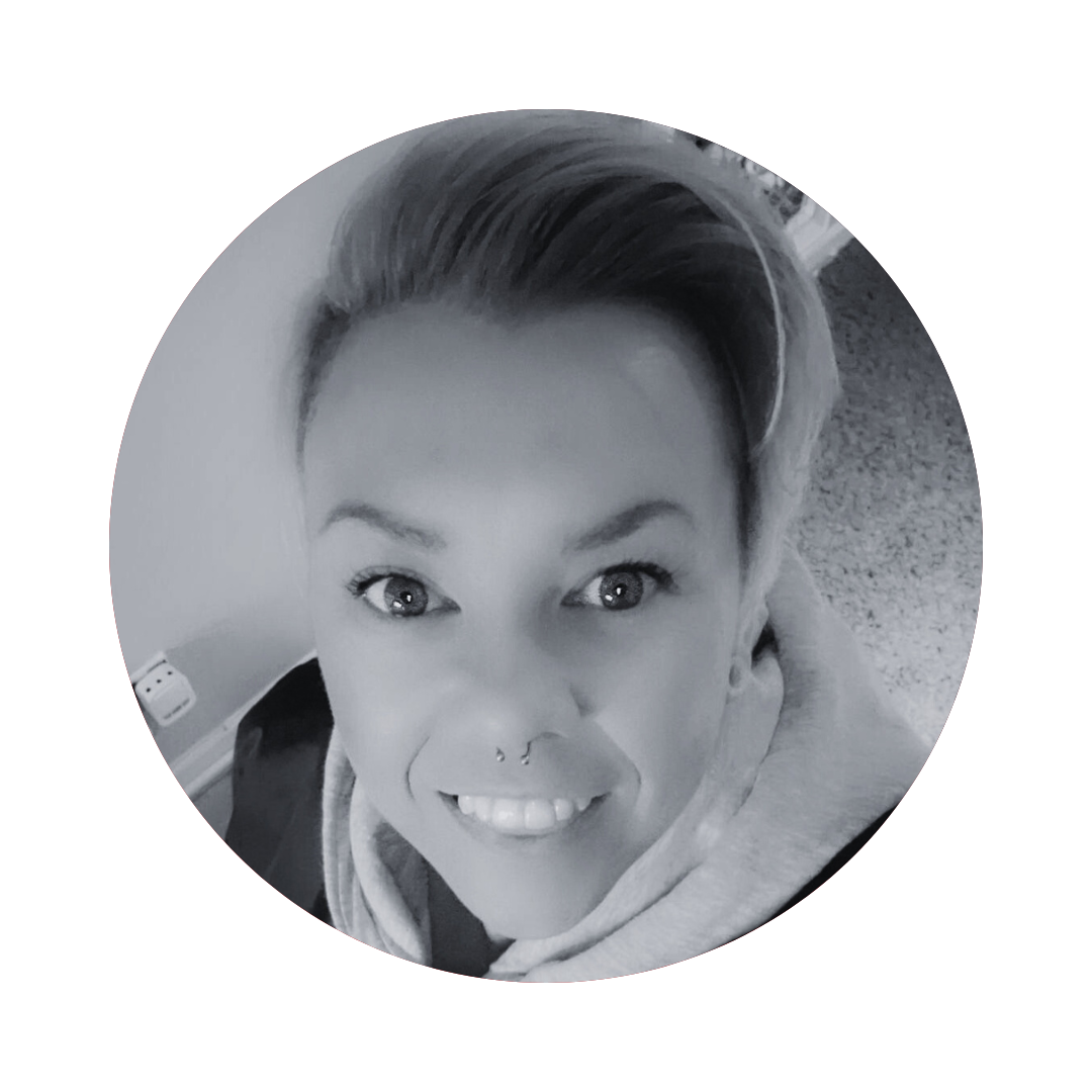 A black and white photo of a woman smiling in a circle.