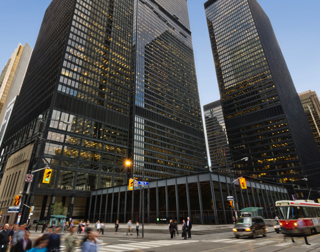 A busy city street with lots of tall buildings