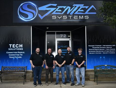 Sentec Systems team outside its downtown Bellville, Ohio headquarters.