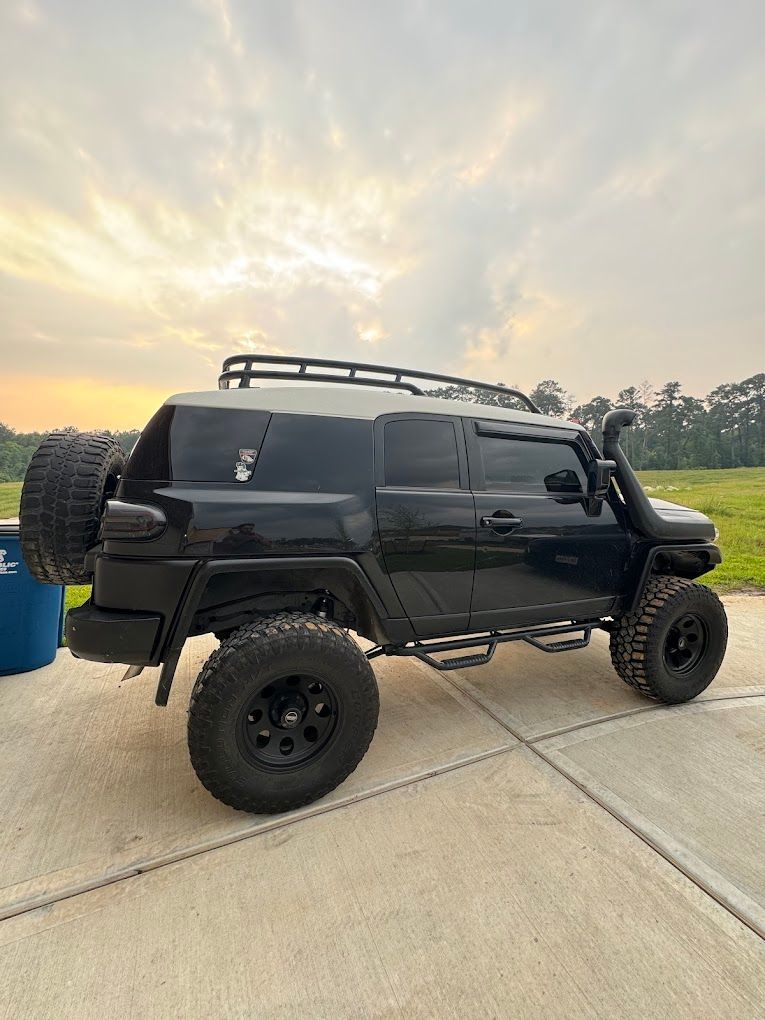 An SUV on lifted wheels.