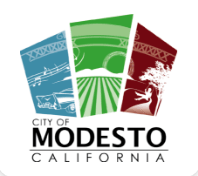 City of Modesto, California logo with blue, green, and red panels and white line art