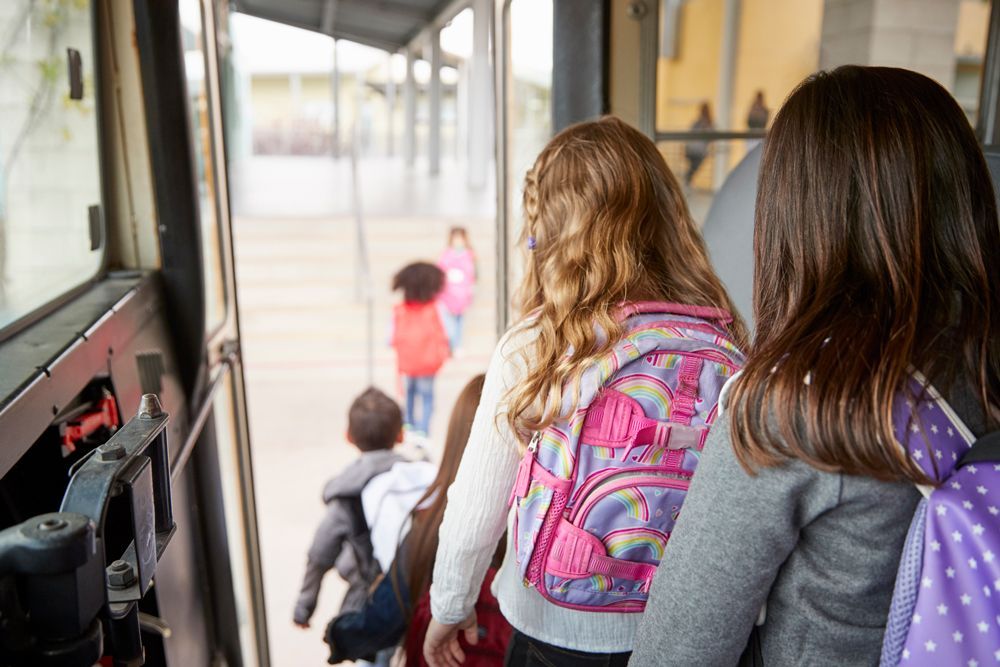 Student Get Off School Charter Bus — Cotswold Hills, QLD — Robertson's Bus & Coaches
