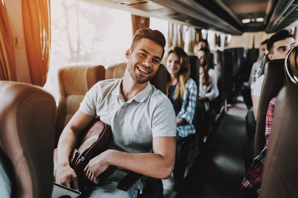 Man Relaxing on a Bus — Cotswold Hills, QLD — Robertson's Bus & Coaches