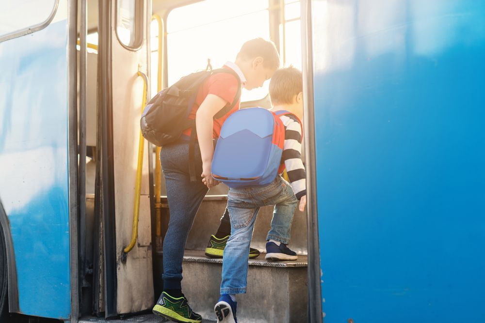 Students Entering Charter Bus — Cotswold Hills, QLD — Robertson's Bus & Coaches