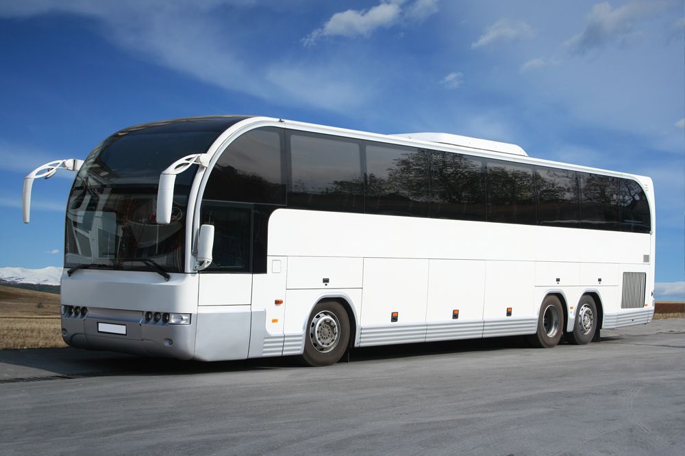 White Charter Bus on the Road — Cotswold Hills, QLD — Robertson's Bus & Coaches
