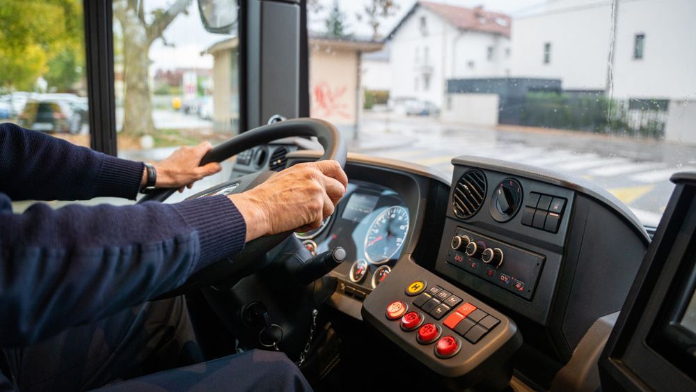 Man Driving Bus — Cotswold Hills, QLD — Robertson's Bus & Coaches