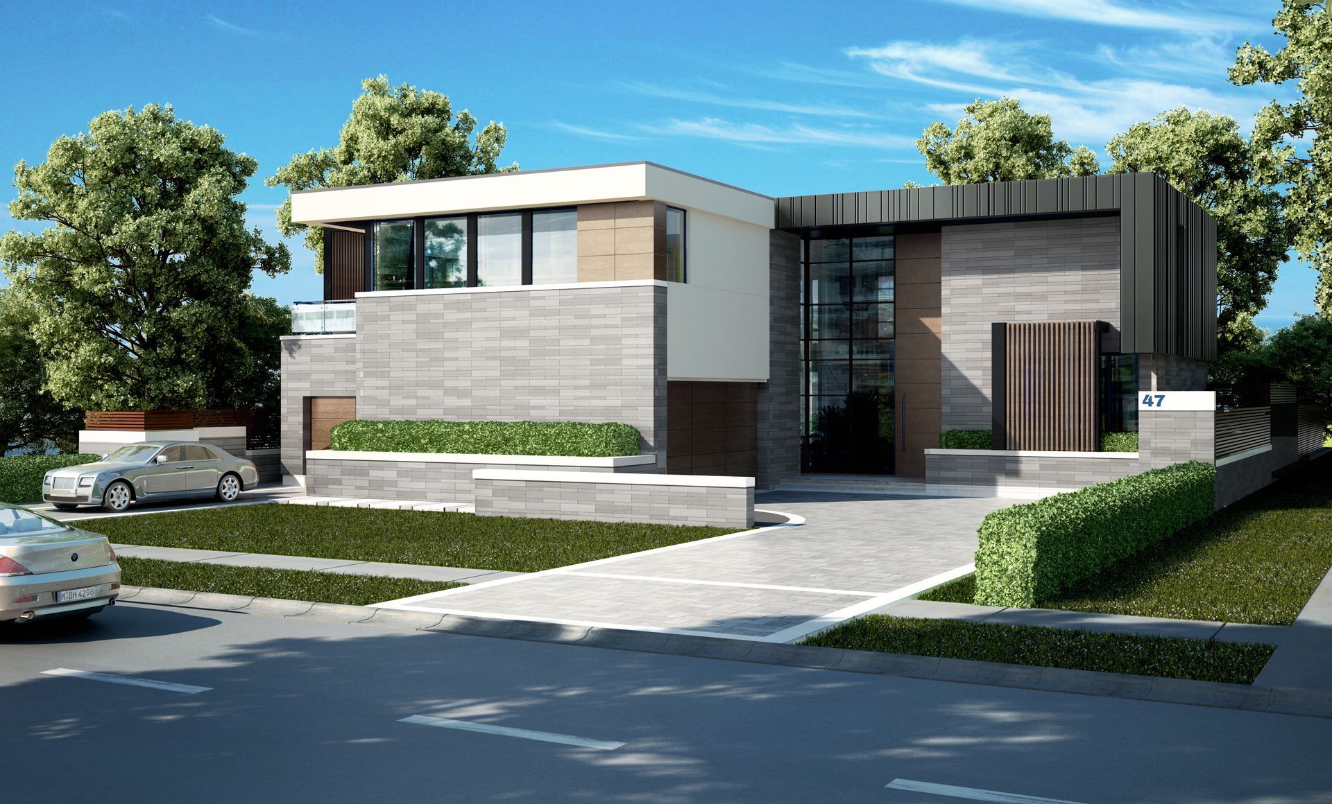 Modern two-story house with gray stone facade, white accents, and a paved driveway. Cars are parked in front.