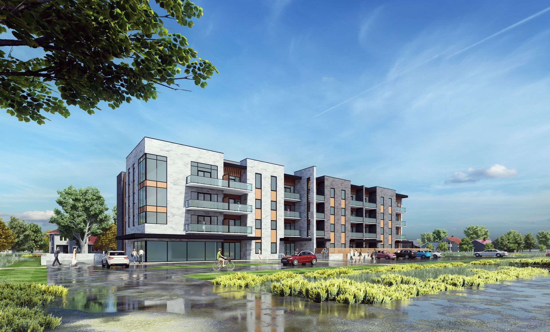Modern apartment building with glass balconies, cars parked outside, and reflecting water.