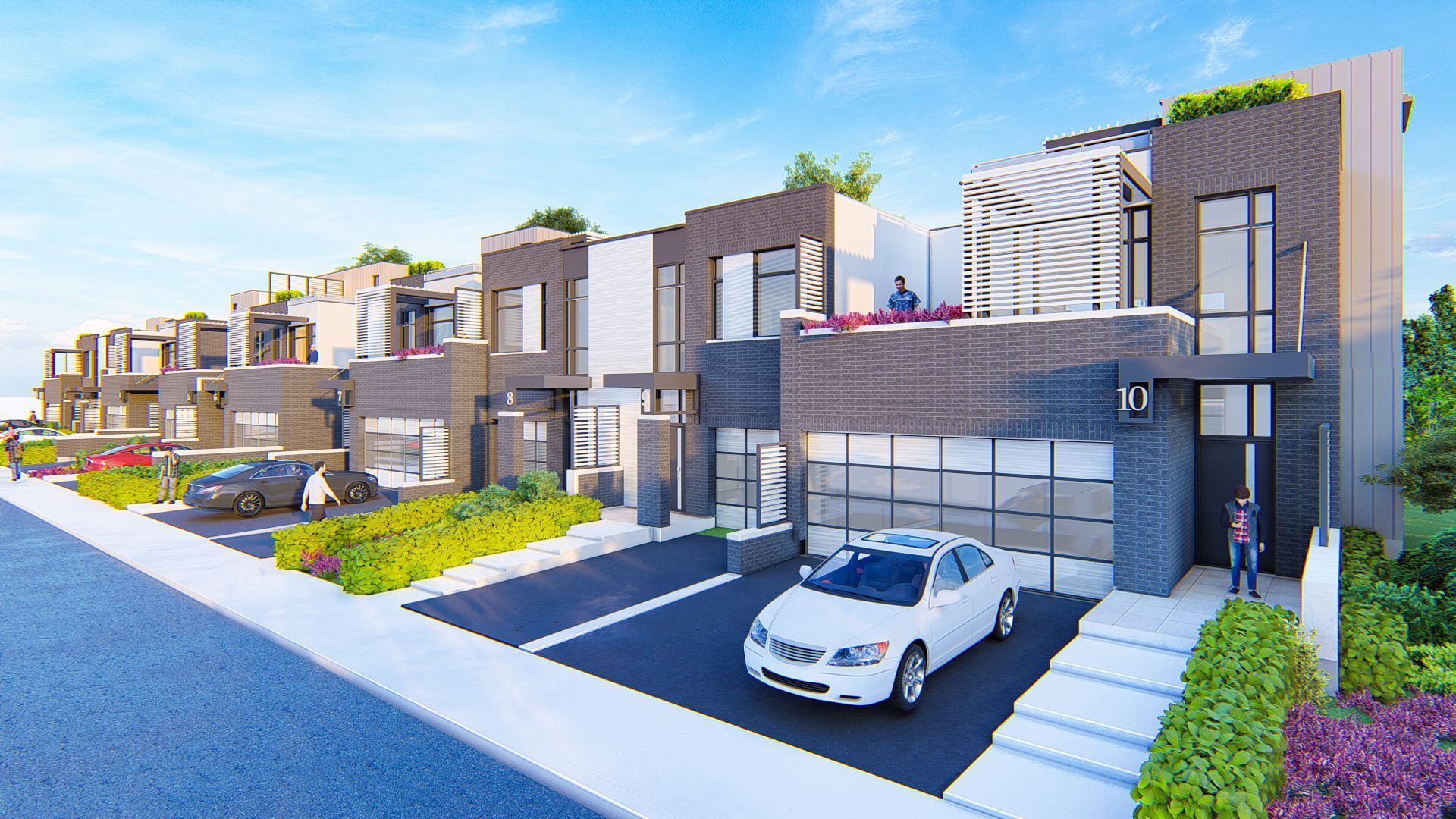 Modern townhouses with cars parked in driveways, featuring brick and glass facades.