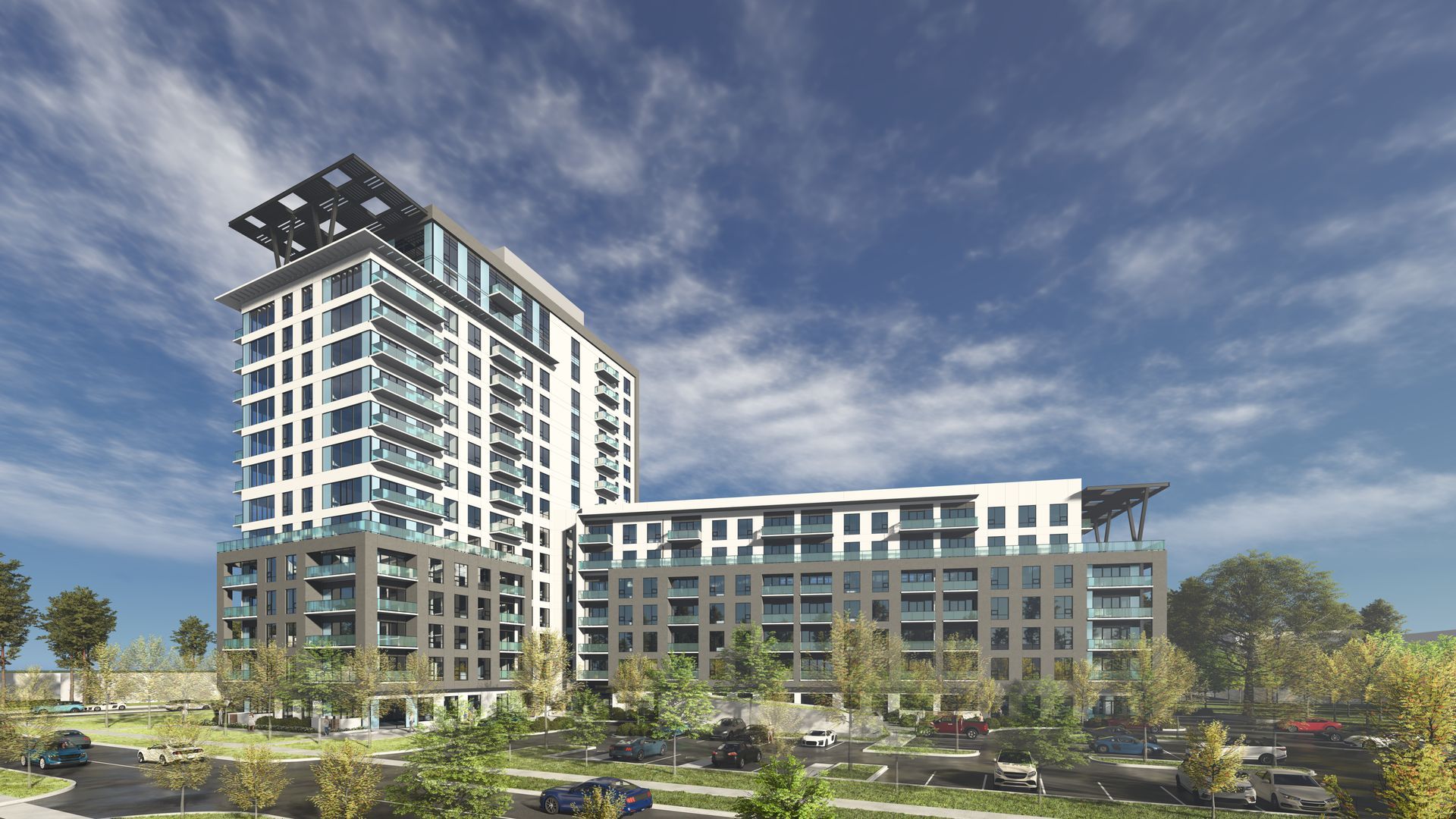 Modern high-rise apartment building with balconies, surrounded by trees, against a blue sky.