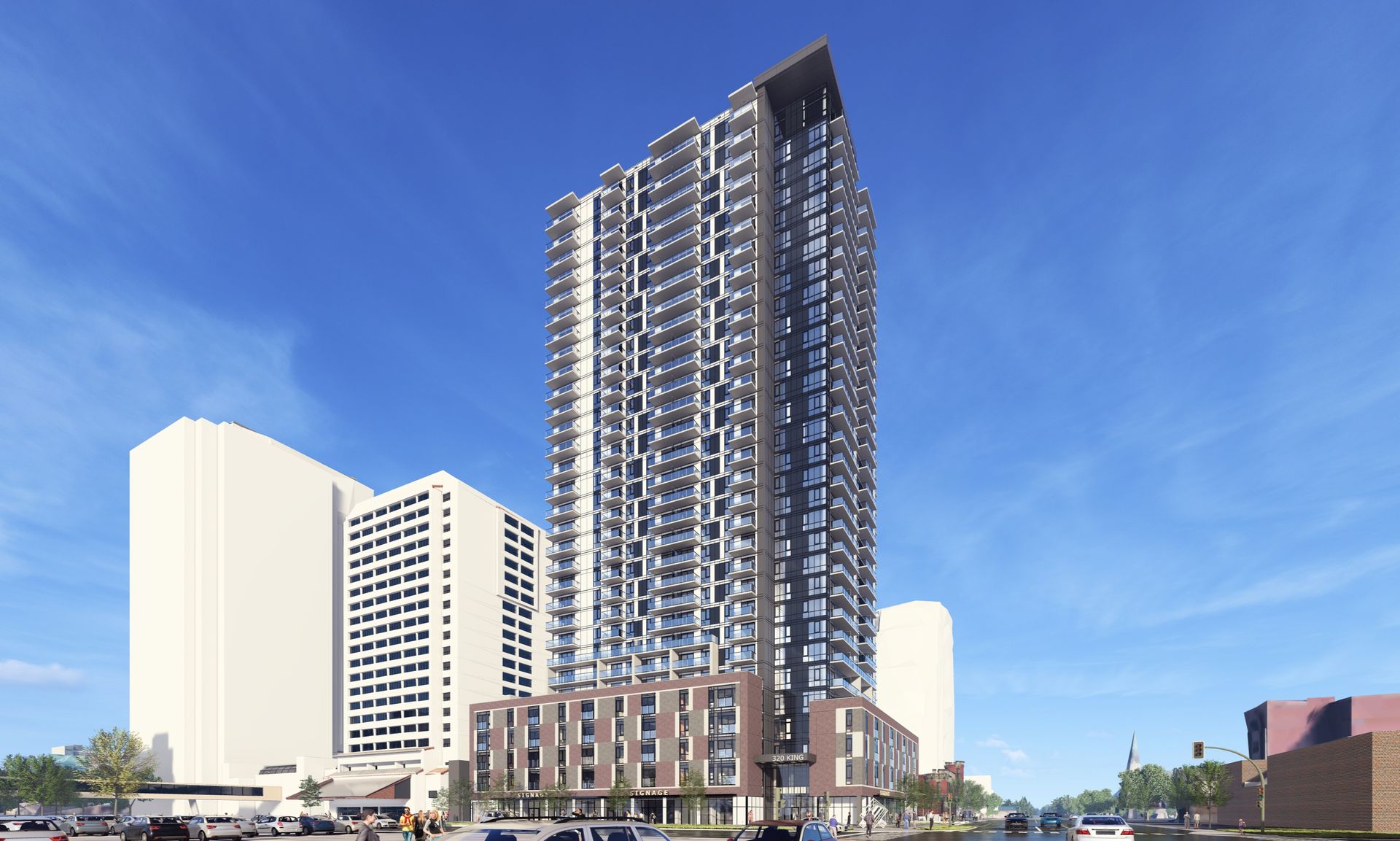 Tall, modern apartment building with a dark facade against a blue sky; other buildings and cars are visible in the setting.