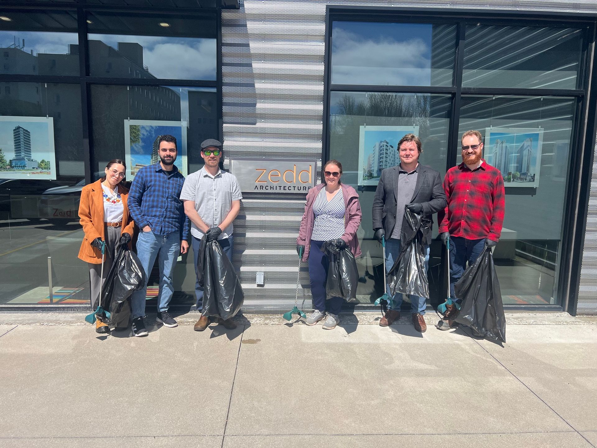 Zedd Architecture team members ready to pick up garbage