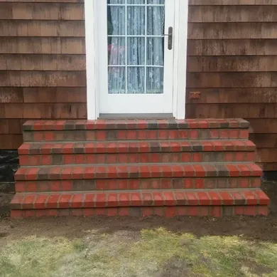 Newly finished brick steps after EFD Masonry’s porch restoration in Metro Oakland County.