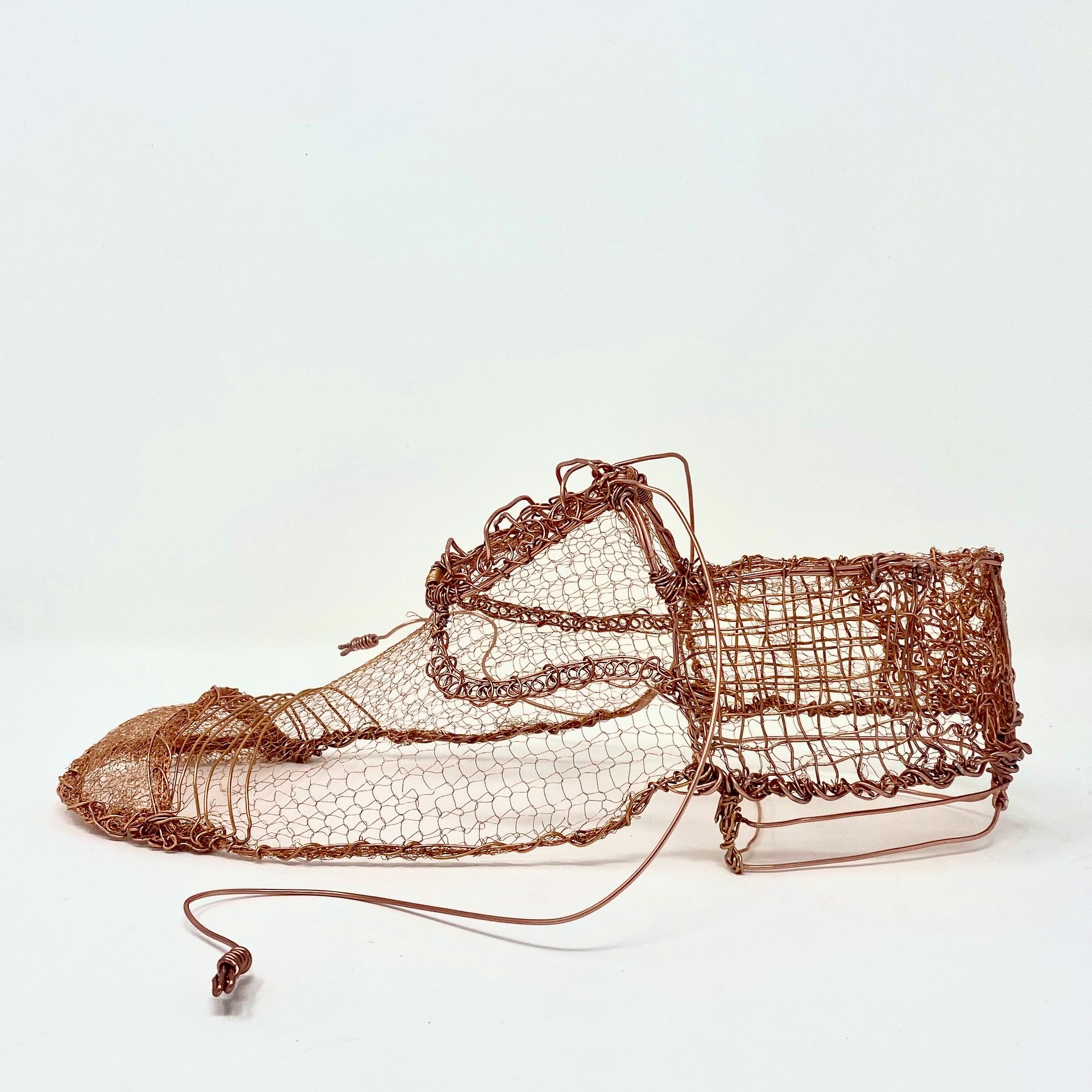 wire sculpture in copper . Gentlemans shoe