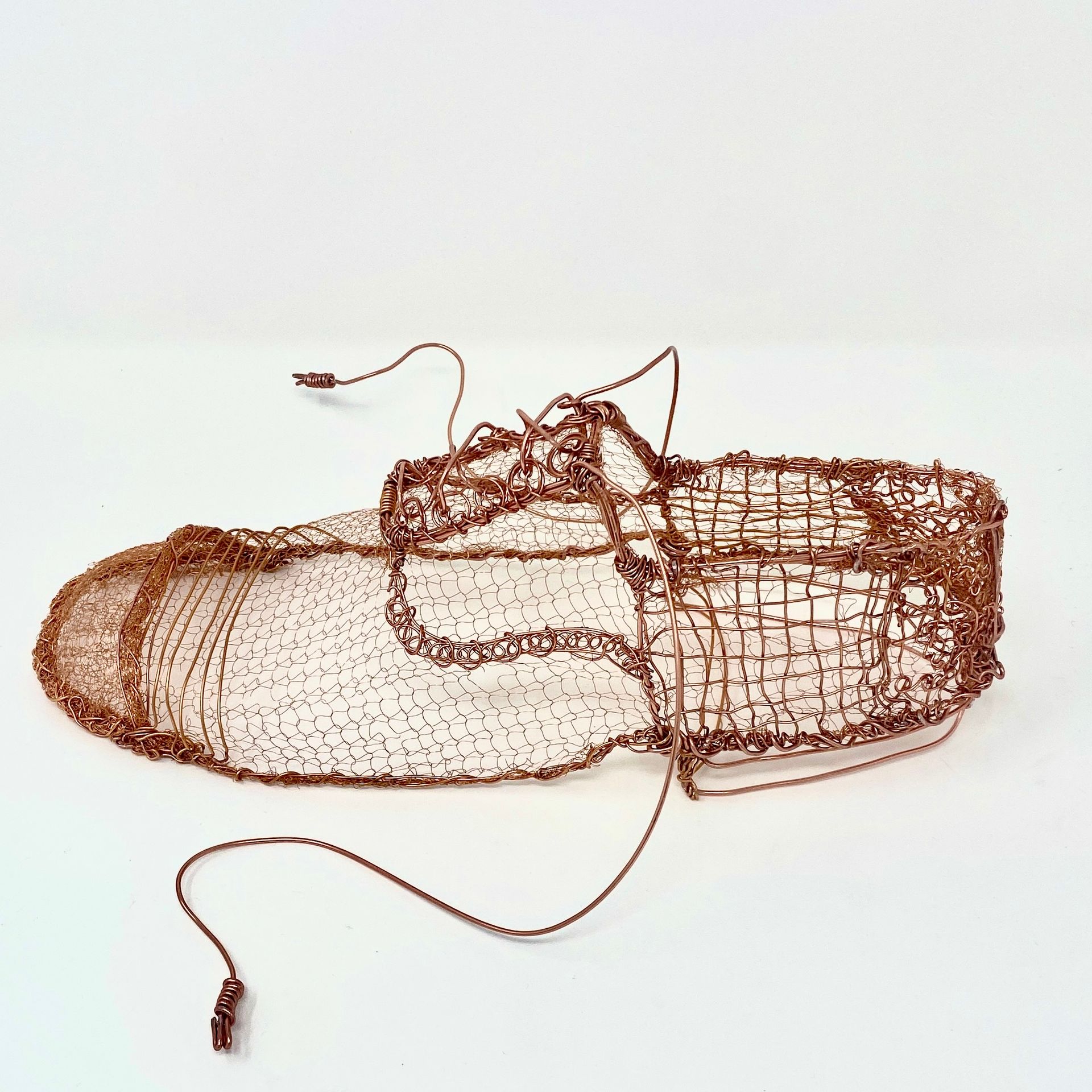 wire sculpture in copper . Gentlemans shoe