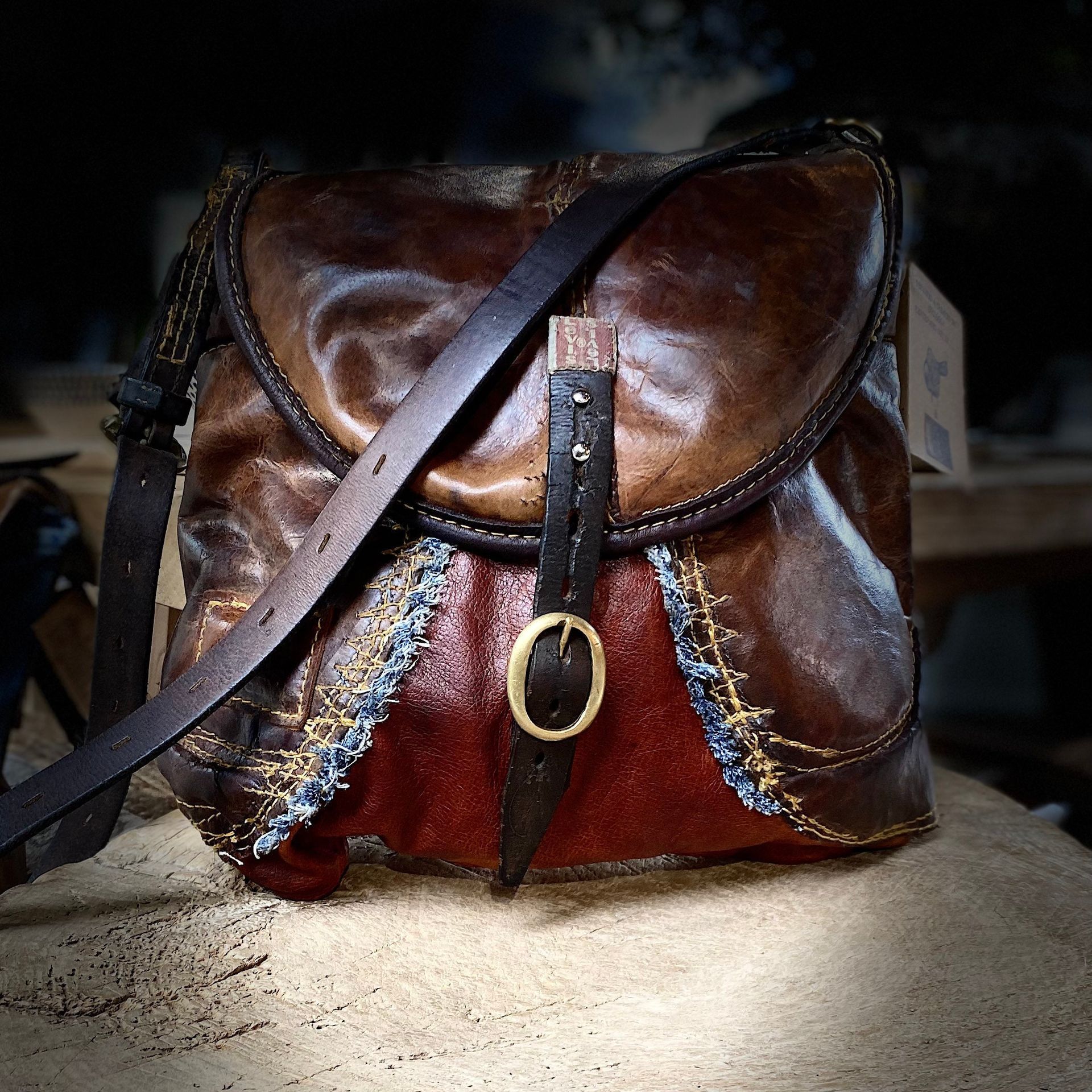 Handbag saddlery,tan leather & Levi’s interior with pockets leather shoulder strap adjustable to crossbody style