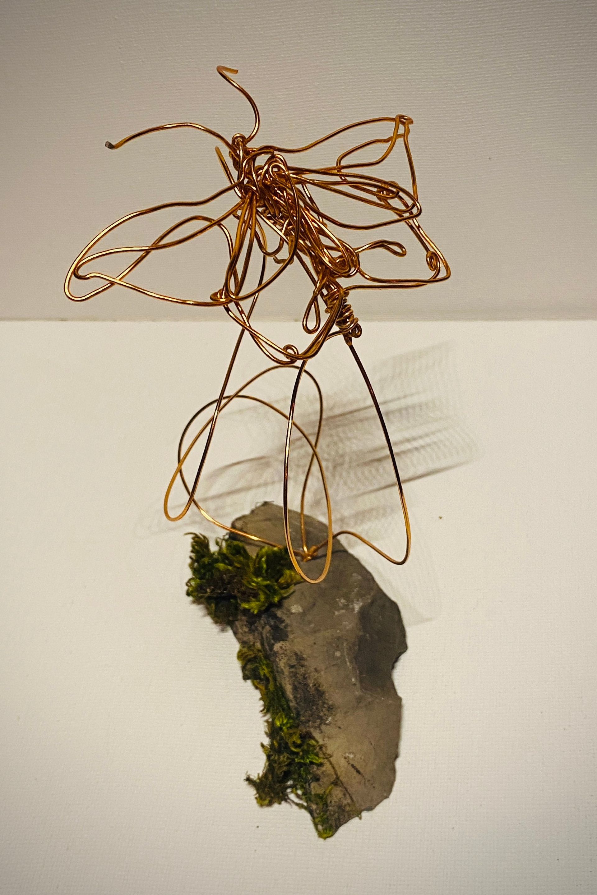 Butterfly copper wire art sculpture mounted on moss slate