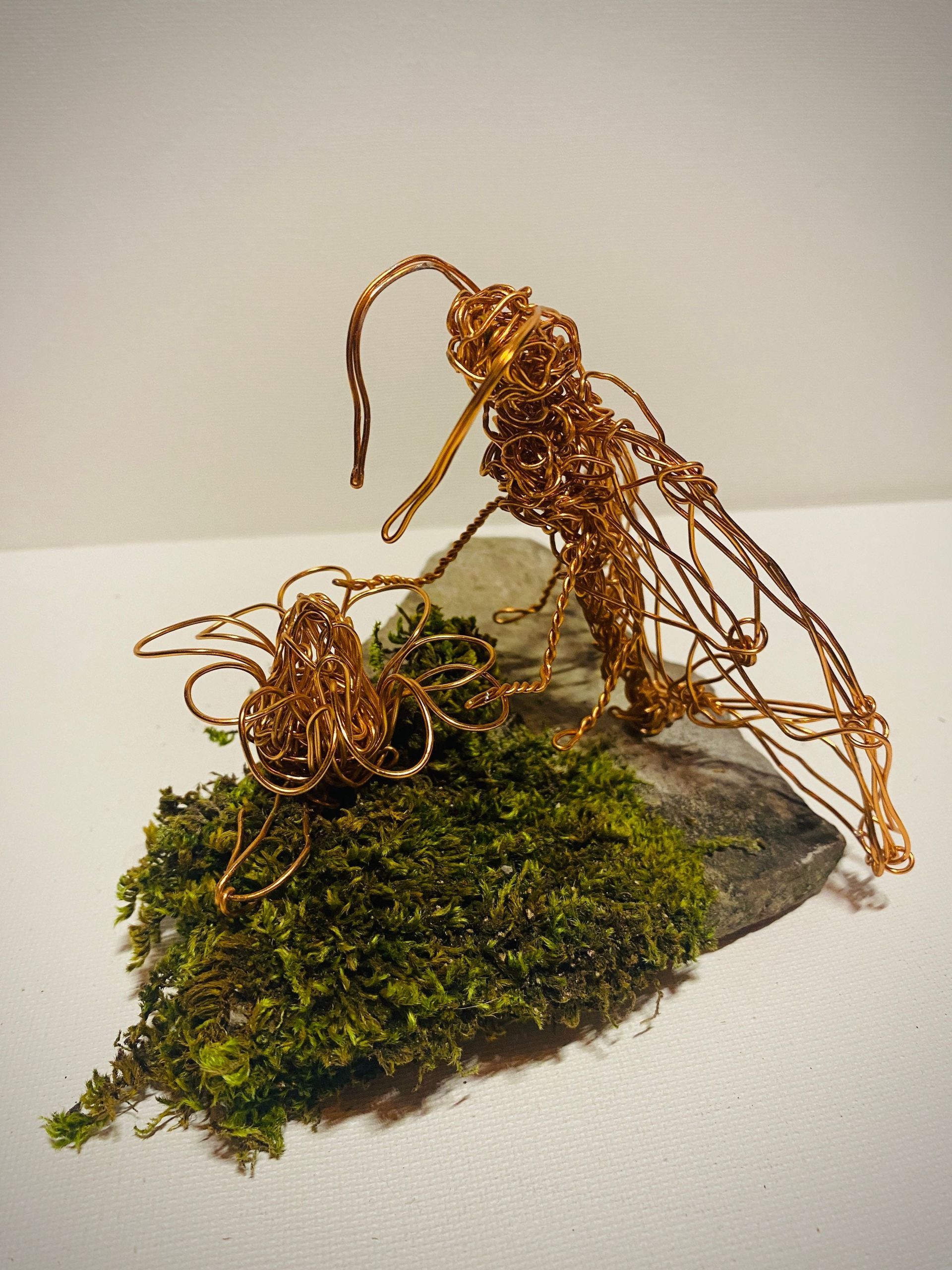 Pollinating moth copper wire art on moss slate plinth