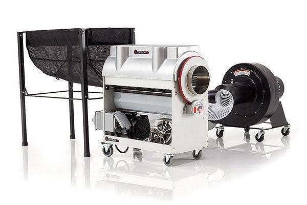 Industrial heating and ventilation equipment: two black fans and a white portable machine on wheels