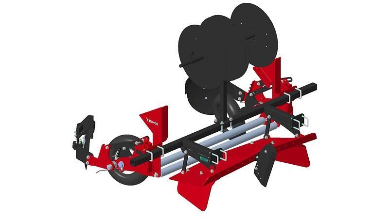 Red and black mechanical assembly with wheels and mounting parts on a white background