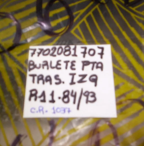 Nota manuscrita blanca con texto negro sobre un fondo estampado amarillo y negro, que dice “BURETE PTA TRAS. IZQ A11-84/93”.