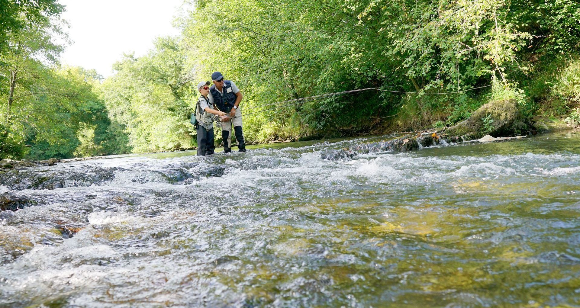 Father and Son fly fishing in the river