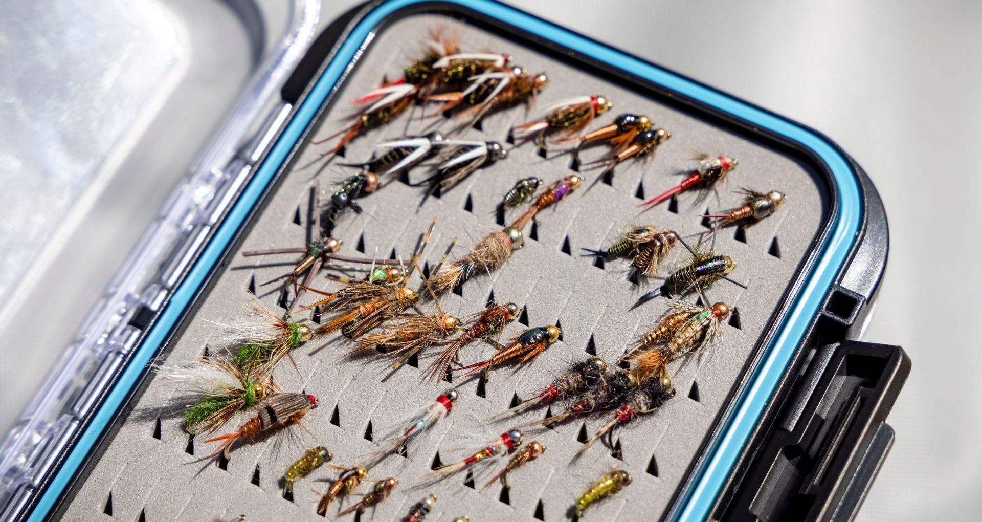 Artificial fishing lures in a tackle box